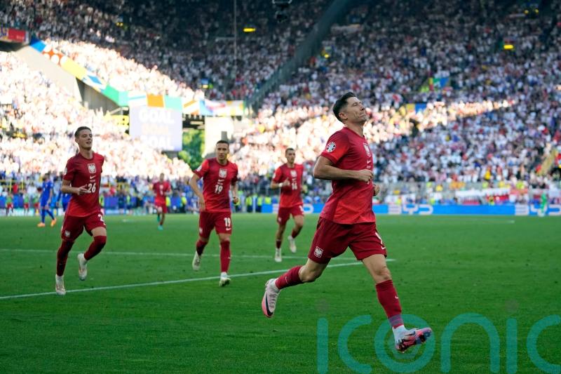 Robert Lewandowski penalty earns Poland a point as France miss out on top spot