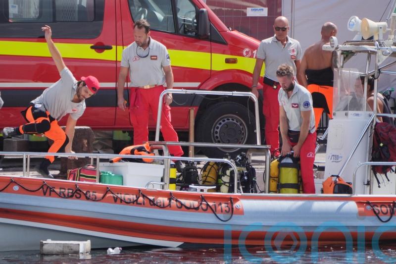 Search for six people missing in sunken superyacht enters third day