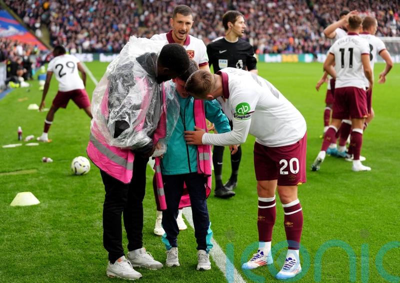 West Ham duo free ball boy from under collapsed hoarding amid fan celebrations