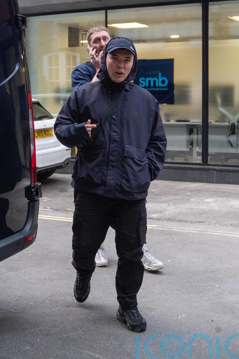 Kneecap star arrives at show with tape over mouth a day after terror charge