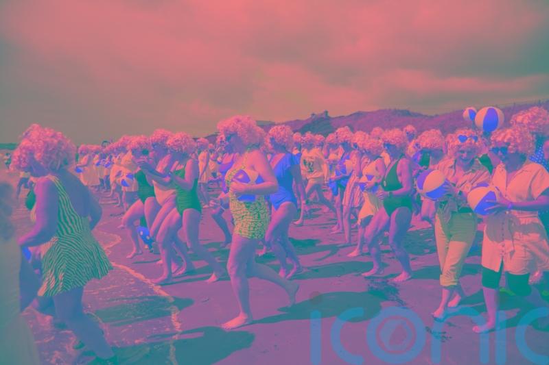 Almost 200 Marilyn Monroe lookalikes take the plunge for charity swim