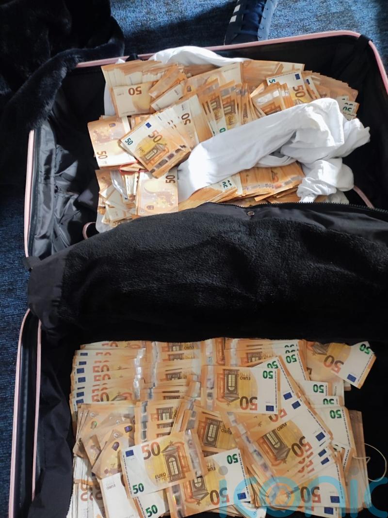 Three men arrested after gardai find almost 350,000 euro cash in suitcase