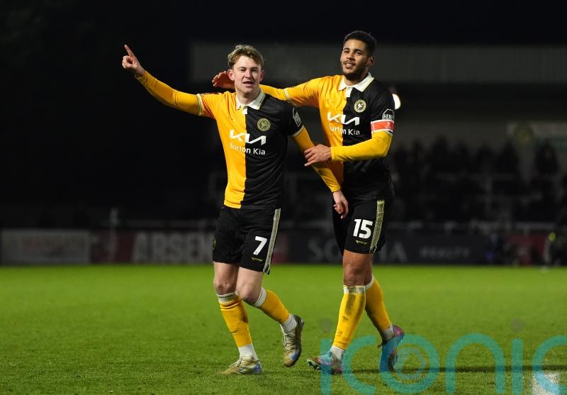 Burton stun Huddersfield to climb out of relegation zone