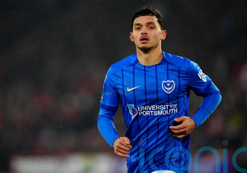 Late Andre Dozzell goal earns 10-man Pompey a draw with relegation rivals Oxford